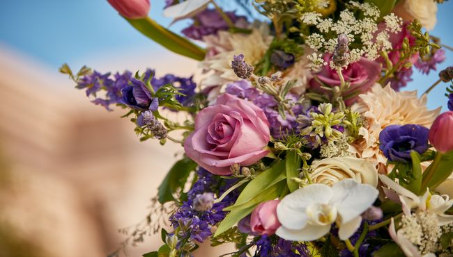 Close up view of the flowers on a memorial wreath on a stand at Pacific View